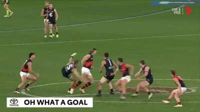 Young Essendon mids combine for center clearance goal