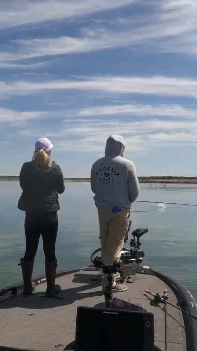 To fly a drone during a fishing trip