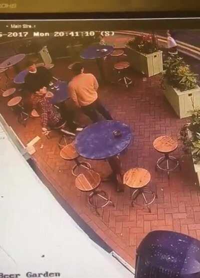 Someone tries to throw a rock through this restaurant's window, guy catches it mid air with his beer still in hand.