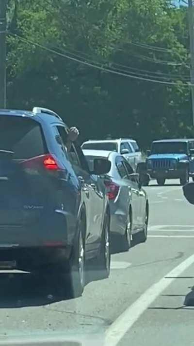 These people played Rock Paper Scissors out the window at the stoplight.