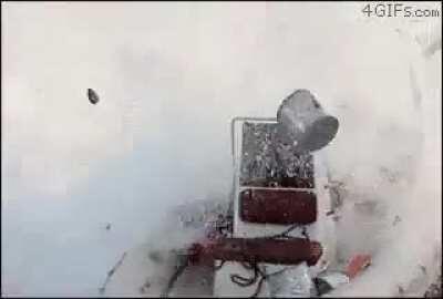 Idiot drop a grenade into the water alongside their inflatable boat.