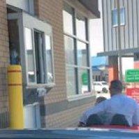 Dad and son getting some food in a cute car