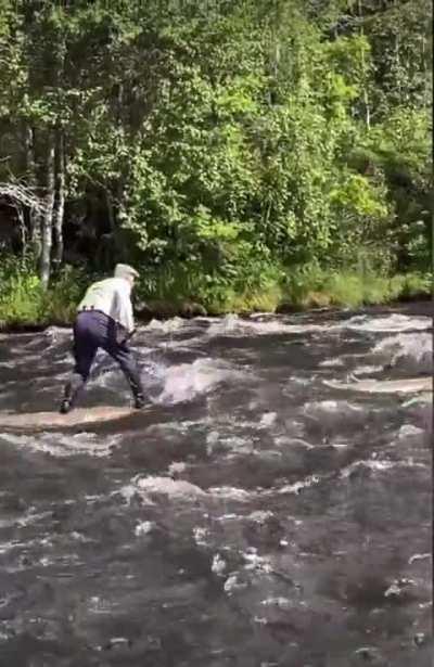 Older log-rider navigates a rapid stream. This is a different skill.