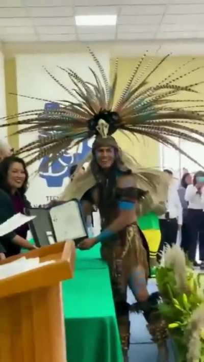 Engineering student decided to receive his degree with ceremonial indigenous attire.