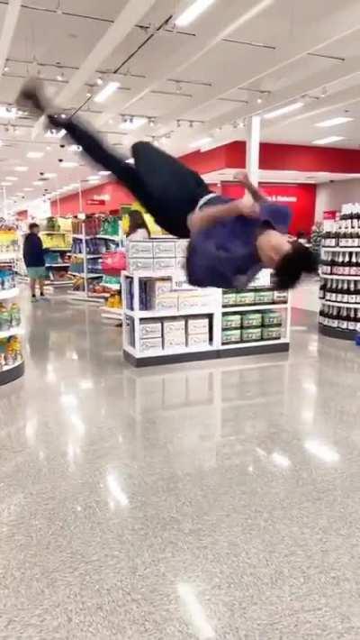 Kid thinks he is cool with unlimited backflips in a Target