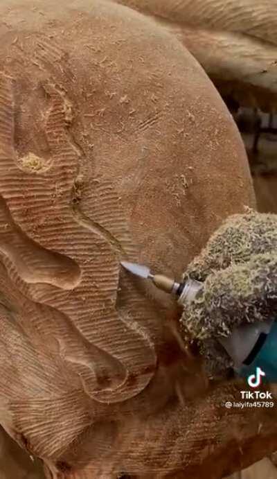 This guy and his tree trunk art are amazing.