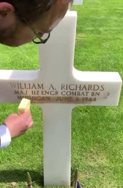 French caretakers take the sand from Omaha Beach and scrub them into the letters to give them the brown/gold coloring.