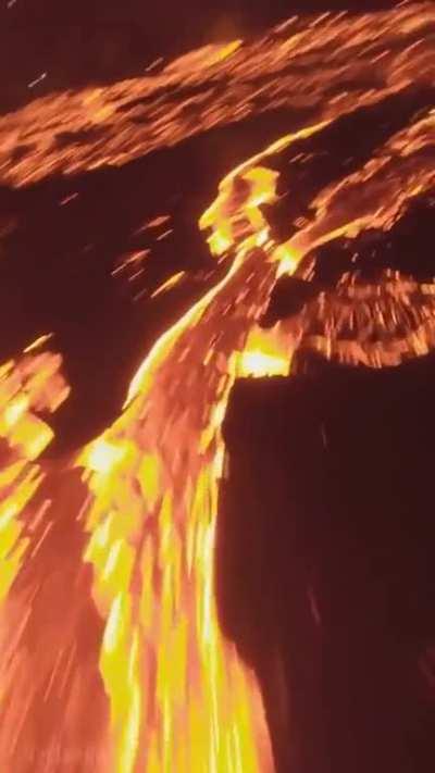 🔥 Drone footage over a volcano erupting at night