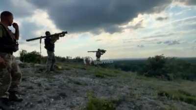 A pair of Russian su25âs popping flares to evade a Ukrainian anti air missile team