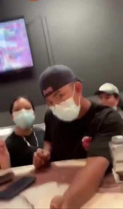 A black woman screams at Asian boba tea employees for cultural appropriation. She felt Boba tea is black culture. When a black man in line behind her spoke up she called him a slur.