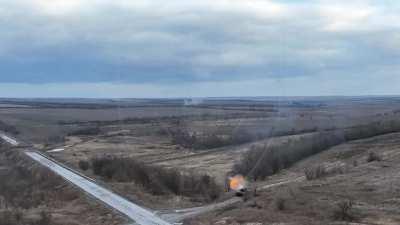 A Ukrainian tank from the 65th brigade destroys a russian position that was spotted by a drone