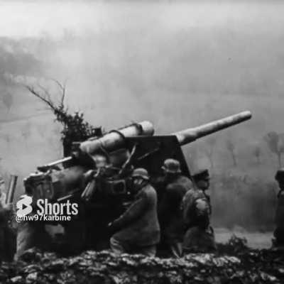 88mm Flak guns firing timed air bursts at ground targets during the Ardennes Offensive in late 1944