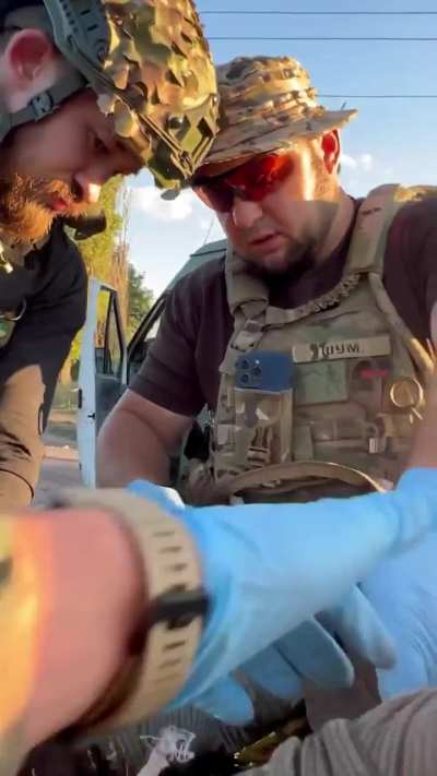 Combat medics of the Ukrainian Volunteer Army treat wounded comrades at the stabilization point. October 2024.