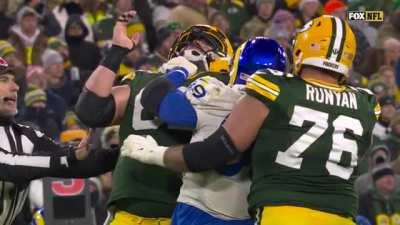 Rams defensive tackle Aaron Donald choking a Packers offensive lineman