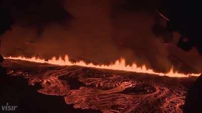 First aerial footage captured just minutes ago of the newly opened volcanic fissure near Grindavík, Iceland. It is estimated to be about 3 km long!