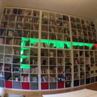 Guy turns his bookshelf into a snake game