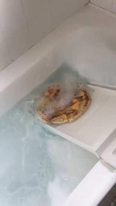 To enjoy pizza in the bath