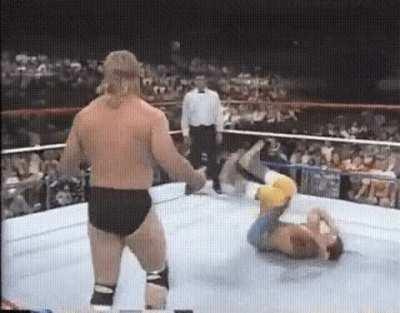 Jacques Rougeau challenges his opponent to do a kip-up.