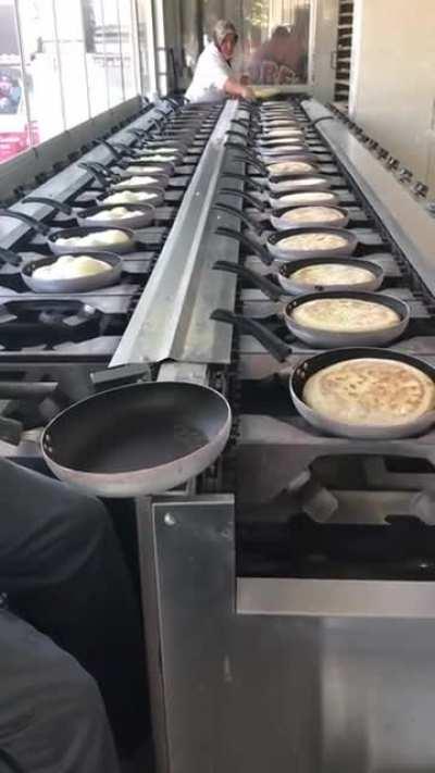 An assembly line for baking bread in Morocco.