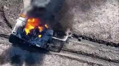 Ukrainian drone dropping a munition on a Russian tank crew who lost their tank to a mine