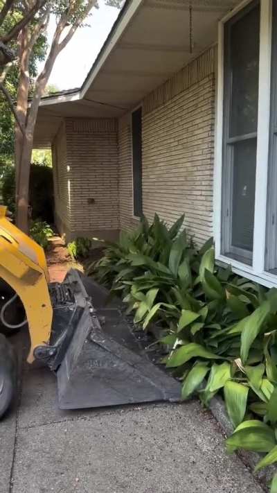 Using a bull dover to remove a garden bed