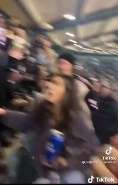 Lady is attacked after confronting a flasher at a hockey game.