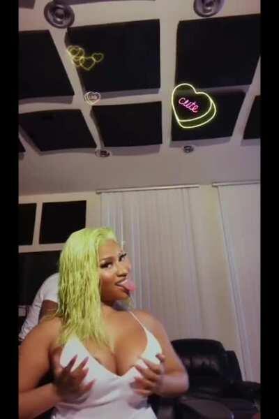 Nicki Minaj juggling her big tits until her areola peaks out on ig