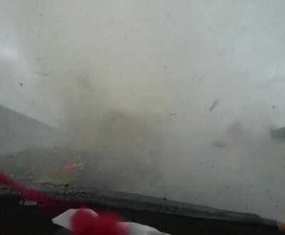 White car cuts off driver and gets swallowed by a tornado