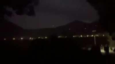 Anti-Junta Forces attacking a Myanmar Army position near the town of Pang Hseng, Northern Shan State. Filmed from the Chinese side of the border.