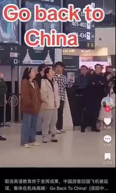 Chinese people shouting &quot;Go back to China&quot; after their flight back to China was delayed at the airport.