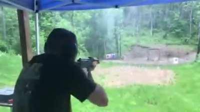 AK-47 muzzle blast deflecting rain