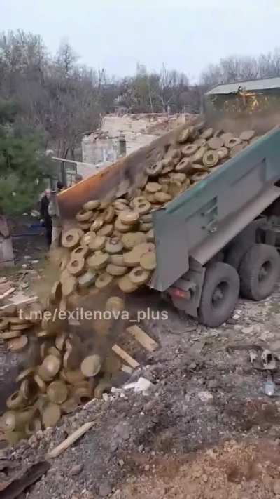 Ukrainians unloading a truck full of anti-tank mines 