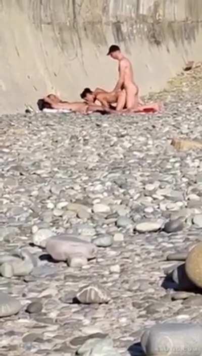 Threesome on a rocky beach