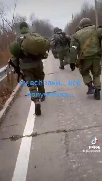 Huge column of Russian troops dragging wounded and under fire