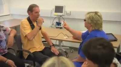 This is the moment a retired British Royal Marine who was diagnosed with Parkinson's disease sees his life change in seconds thanks to a technique called Deep Brain Stimulation. 