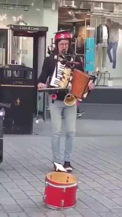 This dude playing instruments one at a time.