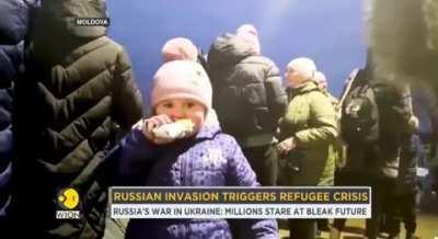 Ukranian little girl in Moldova offers food to the cameraman