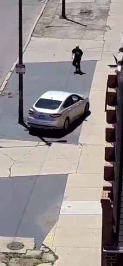 Dude throws rocks at car, instantly regrets it