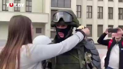 The soldier lowered his shield in front of the demonstrators on Independence Square.