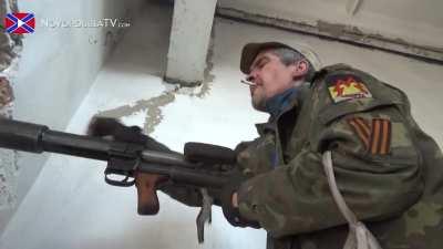 Separatists share tea and cigarettes while skirmishing with Ukrainian forces at Donetsk International Airport - 10/14/2014