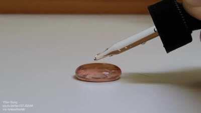 Showing surface tension of water vs. alcohol