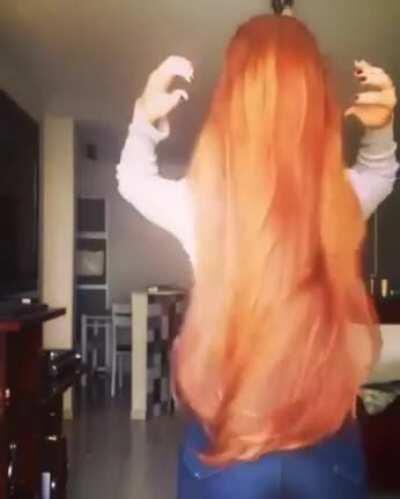 Cascade of long shiny red hair