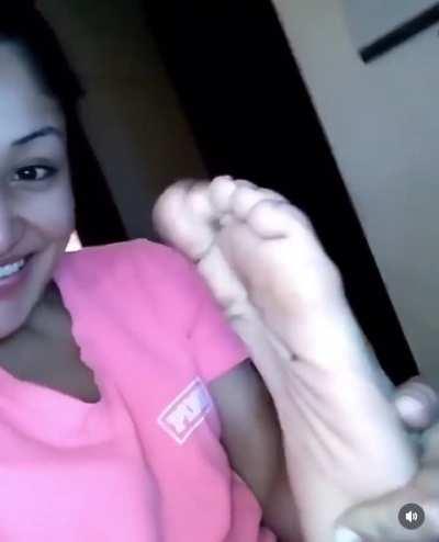 Latina (Hellokimmiesfeet) smells her stinky feet.