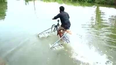 WCGW riding a bike on the river