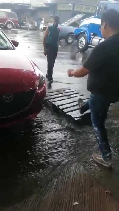 Guy doesn't want his sneakers get wet