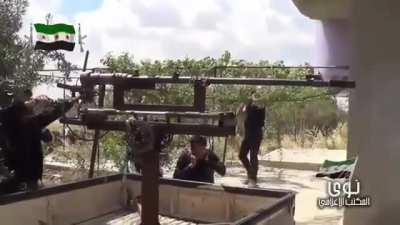 FSA using a cannibalized BMP-2 cannon jerry-rigged on a pickup truck to engage Syrian Army positions - Tel al-Juma - 6/7/2014