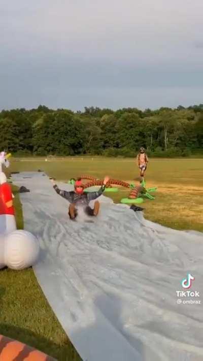 Parachute landing into slip-n-slide