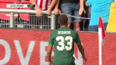 Cyriel Dessers celebrating his goal in front of an angry PSV crowd