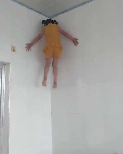 Girl climbing the wall like a spider