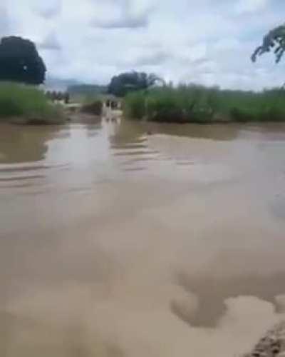 A madlad crossing a channel in Pakistan